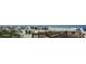 Sunny beach with beachgoers, colorful umbrellas, blue ocean and a wooden boardwalk at 310 N 73Rd Ave. N # 5D, Myrtle Beach, SC 29572