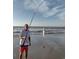 Personal holding fishing pole with caught fish on a sunny beach at 310 N 73Rd Ave. N # 5D, Myrtle Beach, SC 29572