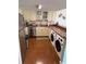 Bright kitchen with stainless steel appliances, cabinets, and a breakfast bar featuring washer and dryer at 310 N 73Rd Ave. N # 5D, Myrtle Beach, SC 29572