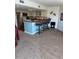 Open kitchen featuring stainless steel appliances, breakfast bar with 3 stools in a cozy home at 310 N 73Rd Ave. N # 5D, Myrtle Beach, SC 29572