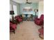 Cozy living room featuring comfortable seating, a ceiling fan, and natural light from large windows at 310 N 73Rd Ave. N # 5D, Myrtle Beach, SC 29572