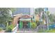 Charming restaurant exterior featuring vibrant colors, lush greenery, and inviting steps, offering an appealing dining experience at 310 N 73Rd Ave. N # 5D, Myrtle Beach, SC 29572