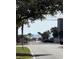 Street view of beach access, framed by palm trees and a glimpse of the ocean, offering a serene coastal ambiance at 310 N 73Rd Ave. N # 5D, Myrtle Beach, SC 29572