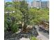 Scenic view of street lined with large trees, with buildings visible in background at 310 N 73Rd Ave. N # 5D, Myrtle Beach, SC 29572
