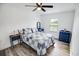 Cozy bedroom featuring a queen-sized bed, matching blue dressers and a ceiling fan at 3117 Chapel Rd., Loris, SC 29569
