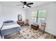 Spare bedroom featuring a full-sized bed, rug, and furniture; natural light shines through the window at 3117 Chapel Rd., Loris, SC 29569
