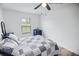 Bedroom with a bed, dresser, and hardwood floors. Natural light shines through the window at 3117 Chapel Rd., Loris, SC 29569