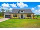 Charming, single story home with a well-manicured lawn and beautiful landscaping at 3117 Chapel Rd., Loris, SC 29569