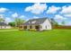 Well-maintained home with a lush lawn and mature trees creating a peaceful setting at 3117 Chapel Rd., Loris, SC 29569