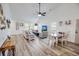 Spacious living room with ceiling fan features a view to kitchen and dining area creating a bright and airy living space at 3117 Chapel Rd., Loris, SC 29569