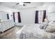Bright main bedroom features decorative tray ceiling, neutral decor, and ample natural light enhancing the relaxing atmosphere at 3117 Chapel Rd., Loris, SC 29569