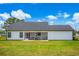 Lovely back of home, featuring a screened porch with a cozy seating area for relaxation at 3117 Chapel Rd., Loris, SC 29569