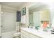 Bathroom featuring double vanity, framed artwork and bathtub-shower combo in a well-lit space at 3300 Bay View Ct., North Myrtle Beach, SC 29582