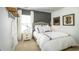 Charming bedroom featuring a stylish gray accent wall, plush pillows, and elegant bedside decor at 3300 Bay View Ct., North Myrtle Beach, SC 29582