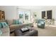 Relaxing living area with a sectional sofa, modern accents, and a large window for natural light at 3300 Bay View Ct., North Myrtle Beach, SC 29582