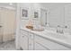 Well-lit bathroom with white cabinetry, modern fixtures, and tasteful decorations, creating a clean and inviting space at 3320 Bay View Ct., North Myrtle Beach, SC 29582