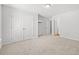 Bright bedroom featuring neutral carpet, double closet doors, and access to an en-suite bathroom at 3324 Little Bay Dr., Conway, SC 29526