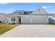 Charming single-story home with a two-car garage and a well-manicured lawn on a sunny day at 3324 Little Bay Dr., Conway, SC 29526