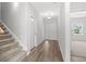 Welcoming hallway with wood floors leads to the entrance with stairway to the left at 3324 Little Bay Dr., Conway, SC 29526