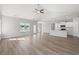 Open-concept living room with wood floors and kitchen featuring a view of the nearby lake at 3324 Little Bay Dr., Conway, SC 29526