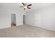 Spacious main bedroom featuring neutral walls, carpet, ceiling fan and a view to an ensuite bathroom at 3324 Little Bay Dr., Conway, SC 29526