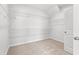Walk-in closet featuring neutral colored carpet, wire shelving and a door at 3324 Little Bay Dr., Conway, SC 29526