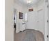 Inviting foyer with neutral paint, tile flooring and a decorative rug at 339 Black Oak Ln. # 201, Murrells Inlet, SC 29576