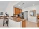 Open kitchen layout with breakfast bar, wood cabinetry, and stainless steel refrigerator at 339 Black Oak Ln. # 201, Murrells Inlet, SC 29576