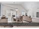 Open-concept living and dining area with vaulted ceilings and large windows, flooding the space with natural light at 339 Black Oak Ln. # 201, Murrells Inlet, SC 29576