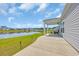 Enjoy outdoor living on this home's covered patio overlooking a scenic lake at 366 Fennec Loop, Conway, SC 29526