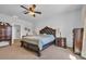 Well-appointed bedroom with a large bed, wooden furniture, and neutral decor at 366 Fennec Loop, Conway, SC 29526