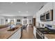 Bright, open kitchen with stainless steel appliances and a view to the dining and living areas at 366 Fennec Loop, Conway, SC 29526