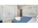 Serene bedroom featuring soft lighting, double door closet and plush blue bedding at 390 Wingspan Ct., Myrtle Beach, SC 29588