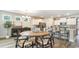 Bright dining area with stylish light fixture and a view to the kitchen at 390 Wingspan Ct., Myrtle Beach, SC 29588