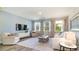 Inviting living room with neutral decor and large windows, offering great natural light at 390 Wingspan Ct., Myrtle Beach, SC 29588