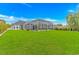 Expansive backyard with manicured lawn and privacy landscaping at 3907 Club Course Dr., North Myrtle Beach, SC 29582