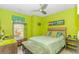 Bright bedroom featuring hardwood floors, a ceiling fan, and a large window at 3907 Club Course Dr., North Myrtle Beach, SC 29582