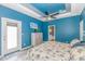 Bright bedroom features an exterior door, ceiling fan, and neutral colored walls at 3907 Club Course Dr., North Myrtle Beach, SC 29582