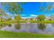 Scenic view of the community pond with a fountain and well-maintained landscaping at 3907 Club Course Dr., North Myrtle Beach, SC 29582
