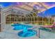 Inviting in-ground pool and spa with screened enclosure at sunset at 3907 Club Course Dr., North Myrtle Beach, SC 29582