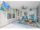 Relaxing screened porch with fan, TV and chairs at 3907 Club Course Dr., North Myrtle Beach, SC 29582