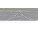Surf washing onto the beach, creating swirling patterns in the water and sand at 404 75Th Ave N # G, Myrtle Beach, SC 29572