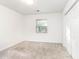 Carpeted bedroom with window and closet, offering a bright and neutral space at 404 75Th Ave N # G, Myrtle Beach, SC 29572