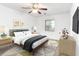 Tastefully decorated bedroom with a ceiling fan and modern furniture, creating a stylish and comfortable space at 404 75Th Ave N # G, Myrtle Beach, SC 29572