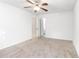 Empty bedroom with neutral walls, carpet, and a ceiling fan awaits your personal touch to transform it into a cozy retreat at 404 75Th Ave N # G, Myrtle Beach, SC 29572