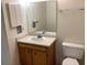 Cozy bathroom with a mirrored vanity and a toilet at 409 Salt Marsh Circle # 20C, Pawleys Island, SC 29585