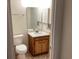 Cozy bathroom with a mirrored vanity and a toilet at 409 Salt Marsh Circle # 20C, Pawleys Island, SC 29585