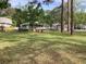 Expansive community green space with mature trees, picnic tables, and a deck area for relaxing at 409 Salt Marsh Circle # 20C, Pawleys Island, SC 29585