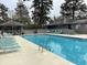 Large, inviting community swimming pool with ample lounge seating at 409 Salt Marsh Circle # 20C, Pawleys Island, SC 29585