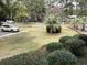 Well-maintained yard with mature landscaping and assigned parking spaces at 409 Salt Marsh Circle # 20C, Pawleys Island, SC 29585